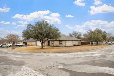 View of front of property featuring a garage and f