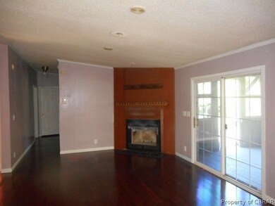 Family room with fireplace and glassed door to por