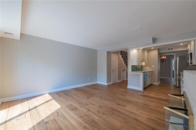 Large sun filled Living Room and open Kitchen