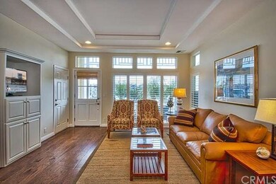 Warm and inviting living room offers plenty of nat