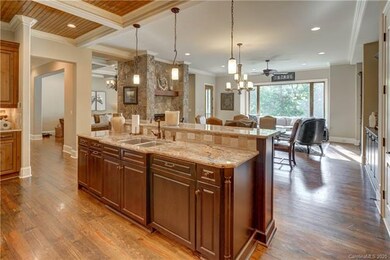 The kitchen includes a wine fridge as well as a tr