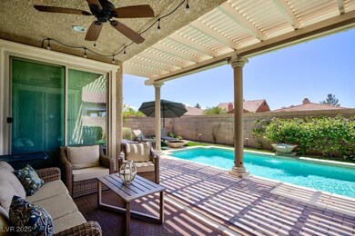 View of pool with a fenced backyard, ceiling fan,