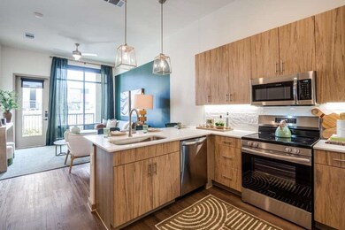 Kitchen featuring sink, appliances with stainless 