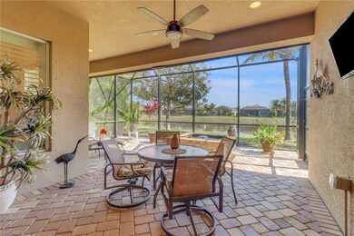 Sunroom featuring a water view and ceiling fan