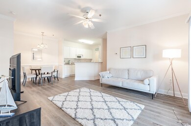 Living area with light wood finished floors, baseb
