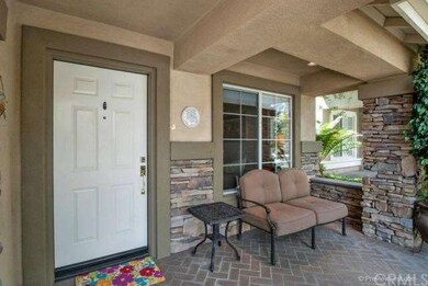 Relax on this cozy front porch with a cup of morni