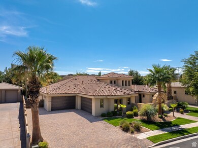 Mediterranean / spanish home with stucco siding, an attached garage, decorative driveway, and a tile roof