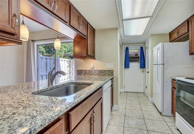 The kitchen also has a tile backsplash, undercabin