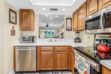 Kitchen with ceiling fan, stainless steel applianc