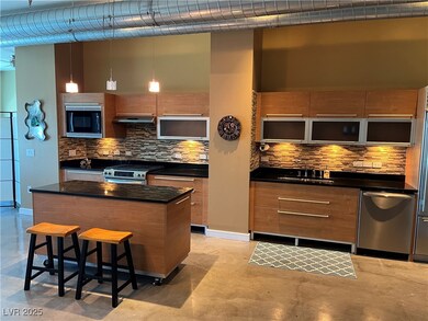 Kitchen with modern cabinets, a sink, appliances w