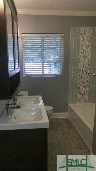 Beautiful Glass Tile with New Fixtures and New Tub
