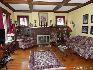 Living Room. Woodburning fireplace with built in b