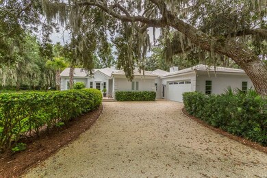 Side yard, grilling porch and two car garage