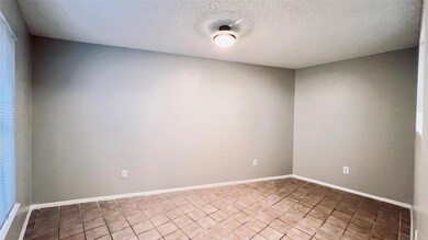 Spare room with a textured ceiling