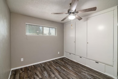 Unfurnished bedroom featuring baseboards, a ceilin