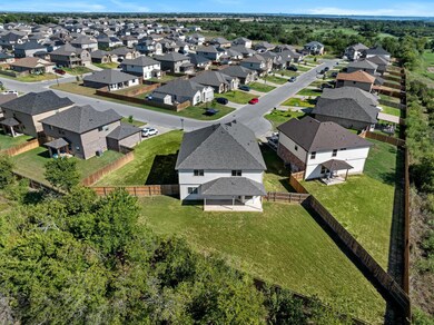 Birds eye view of property with large backyard and