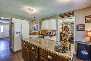 Kitchen is conveniently located off dining room wi