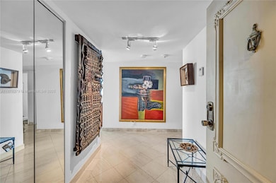 Entryway to greet guests privately with living area to the left and 3 bedrooms and 3 bathrooms on the right.