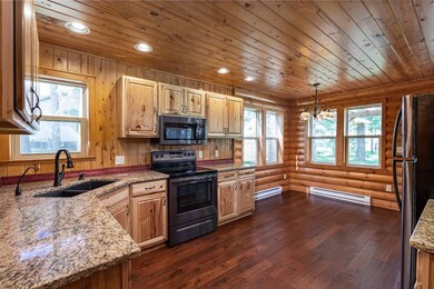 This open kitchen flows in a circle to living room