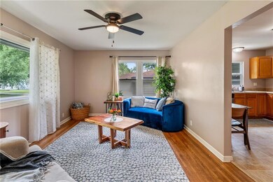 Sunny front living room with hardwood floors