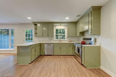 A chef's dream kitchen has been updated and waiting for your creative cooking.  Plenty of cabinets and counterspace, and high quality finishes, throughout.