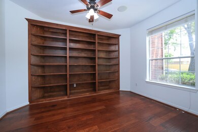 Study or formal living room with stained wood buil