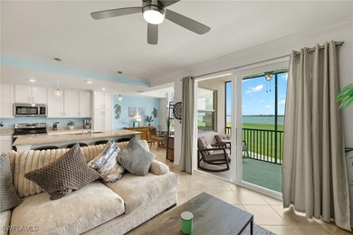 Living area with ceiling fan, ornamental molding,