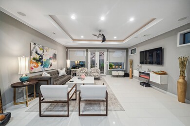 Living area with coffered lighted ceiling, electri
