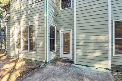 Doorway to property featuring a patio area