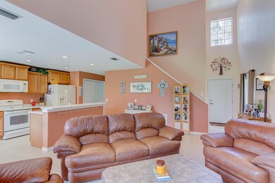 Living Room overlooking Kitchen and stairs to seco