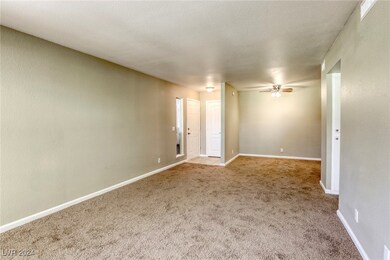 living room looking toward dining area and front e