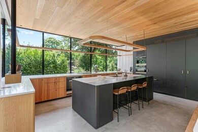 Kitchen with concrete flooring, modern cabinets, 