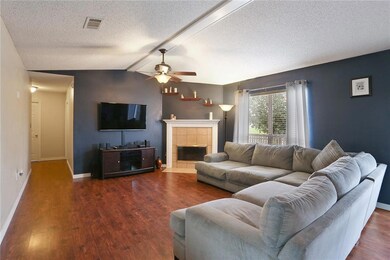 Great room/den with wood burning fireplace and bea