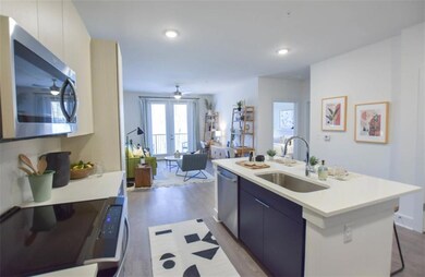 Kitchen with a kitchen island with sink, ceiling f