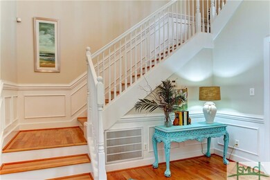 Inviting and dramatic two-story entrance foyer wit