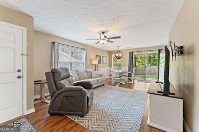 Natural light-filled living room near the foyer an