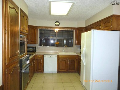 Lovely custom built cabinets and solid surface cou