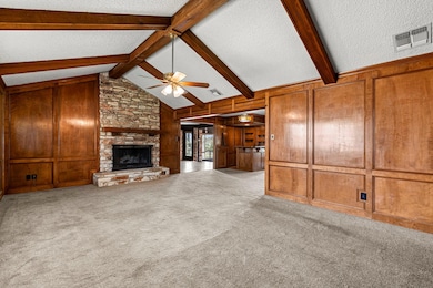 Unfurnished living room featuring visible vents, 
