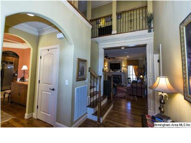 Beautiful entry with arched doorways, hardwood flo