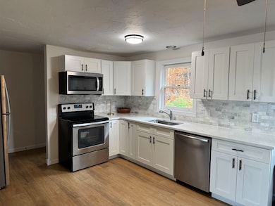 Kitchen...portable island would look nice