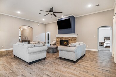 The spacious open concept family room has high cei