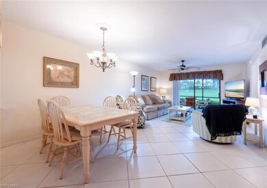 Tiled dining area featuring ceiling fan with notab