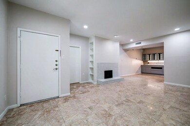 Spacious living with fireplace.