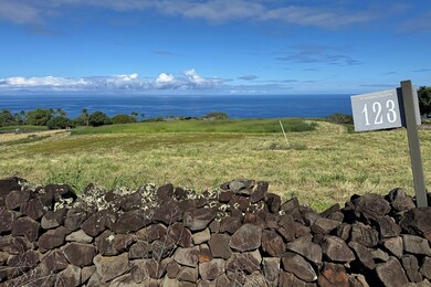 Lot 123 is a rare 1.4-acre corner parcel featuring phenomenal ocean views and a desirable location within the Hokulia community.