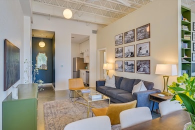 Living area featuring finished concrete floors, a