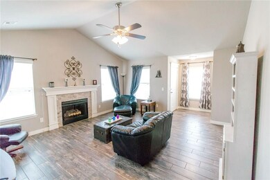Open Living Room with beautiful wood-like tile throughout.