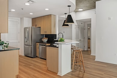 Kitchen featuring new lighting and countertops