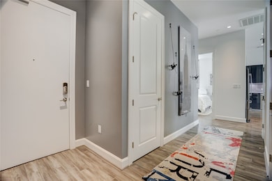 Step inside to a welcoming entryway featuring a mo