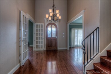 Foyer with extremely tall ceilings.