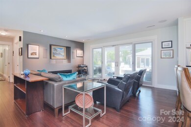 TV retracts down in front of the framed artwork when needed and is hooked to a 5 speaker surround. sound. A gas wall  FP is below the 